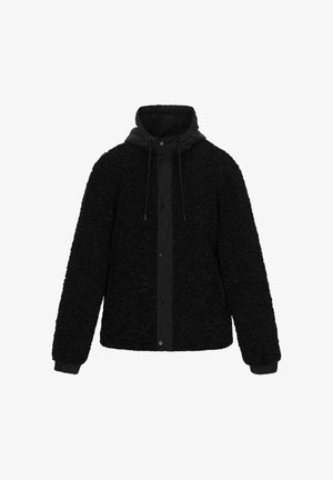 Giacca in pile nera con esterno testurizzato, polsini elastici e cappuccio staccabile con cordini. Chiusura a pressione con bottoni sul davanti.