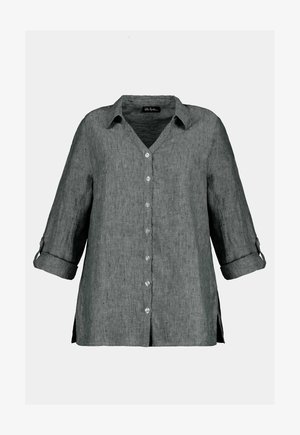 Grau leinenvor dem Hemd mit V-Ausschnitt, Dreiviertelärmeln, Knopfverschluss vorne und seitlichen Schlitzen. Es zeichnet sich durch einen strukturierten, leicht durchsichtigen Stoff aus.