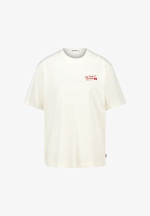 Camiseta de algodón blanca con mangas cortas, escote redondo y texto impreso en rojo "Las Vegas Nevada" en el pecho. Forma casual y relajada.