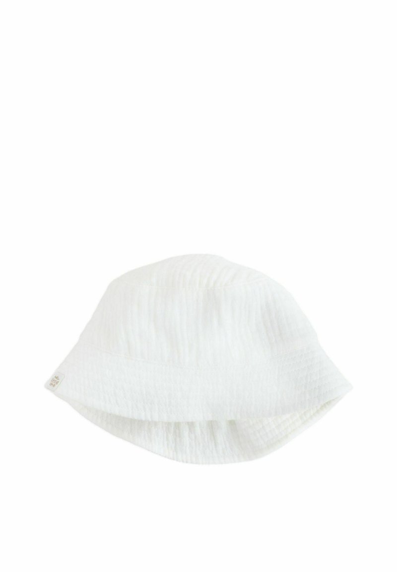 White bucket hat made of textured fabric with a soft, crinkled appearance. Features a wide, floppy brim and a small sewn label.