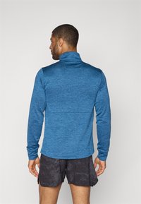 New Balance ATHLETICS GRID 1/2 ZIP - Top dugih rukava - dark shoreline/blue heather