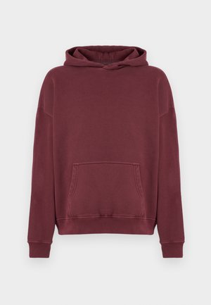 Bordeauxfarbener Kapuzenpulli aus Baumwollmischung, mit großer Fronttasche, gerippten Bündchen und einer Kapuze mit Kordelzug. Weicher Stoff und lockere Passform.