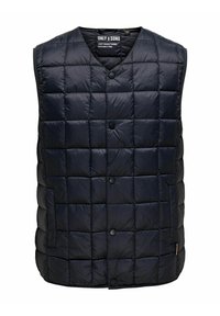 Gilet rembourré bleu marine avec un motif matelassé, doté d'un décolleté en V, de boutons-pression et d'un matériau en duvet lisse et léger.