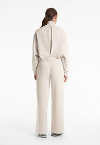 OYSHO SOFT TOUCH HIGH COLLAR STRIPED - Zip-up sweatshirt - sand
