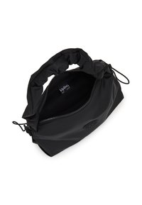 Sac en nylon noir avec une anse froncée en haut, fermeture éclair et étiquette de marque visible à l'intérieur. Présente une texture lisse et mate ainsi qu'une forme arrondie.