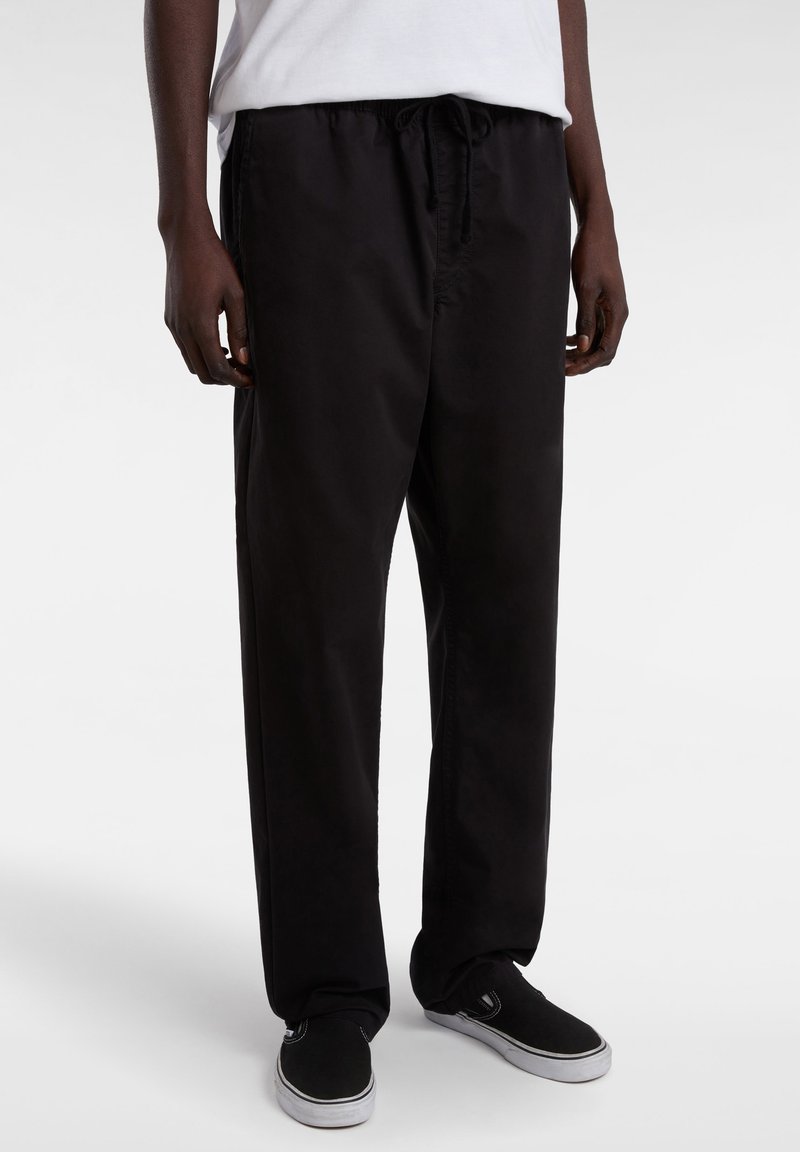 Black trousers made of lightweight fabric, featuring an elastic waistband with drawstring, and a relaxed fit with straight legs.