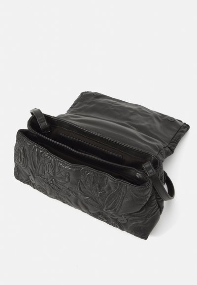 Black leather bag with embossed floral design, featuring a main compartment with two inner pockets and a detachable strap.