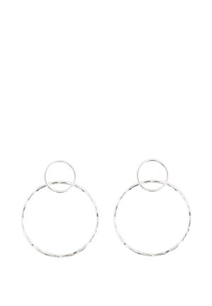 Two silver hoop earrings, each with a smaller hoop attached at the top, on a white background.