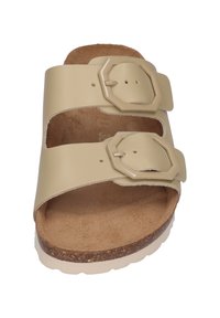 Beige double-strap sandal with decorative octagonal buckles, cork footbed, and rubber sole. Smooth synthetic upper with a textured insole.