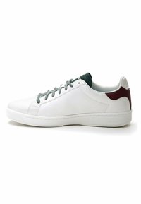 White leather sneakers with green and burgundy accents, featuring round laces, a smooth surface, and a textured rubber sole.