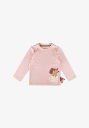Maglietta rosa a maniche lunghe per bambino con un cane che indossa occhiali da sole a forma di cuore seduto dentro una tazza da tè e una piccola applicazione di croissant.
