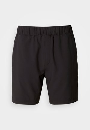 Sorte shorts laget av elastisk stoff, med elastisk midjebånd, sidelommer og et enkelt, rent design. Ingen mønstre eller detaljer.