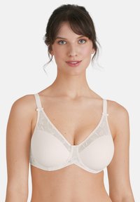 Beige bh met zachte stof, naadloze cups en delicate kantdetails. Verstelbare banden met sluiting aan de voorkant voor extra ondersteuning.