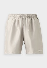 Shorts beiges à taille élastique avec cordon de serrage et poches latérales, avec le logo "PEGADOR" sur la partie inférieure de la jambe droite.