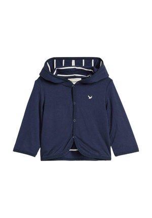Felpa blu navy, realizzata in tessuto morbido, presenta maniche lunghe, una chiusura con bottoni e una fodera interna a righe. Logo di un uccellino ricamato.