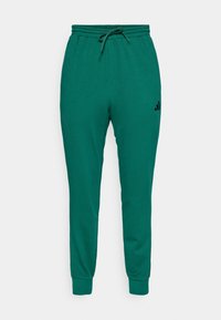 FEELCOZY - Donji dijelovi trenirke - collegiate green/black