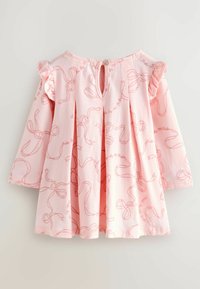 Abito rosa chiaro a maniche lunghe con motivo a fiocchi, maniche arricciate e chiusura a chiave sul retro con bottone. Tessuto di cotone strutturato.