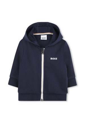 Hoodie zippé bleu marine en tissu texturé, avec une fermeture éclair blanche, des poignets côtelés et un logo sur la poitrine. Hoodie avec intérieur doublé.