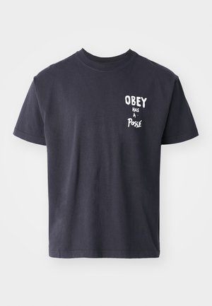 Black cotton t-shirt with short sleeves and a crew neck. Front features white text that reads "OBEY has a Posse." Simple, casual design.