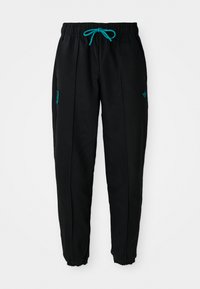 Zwarte sweatpants met een elastische tailleband en turquoise koord. Beschikt over zijzakken en een klein groen logo nabij de taille. Elastische boorden.