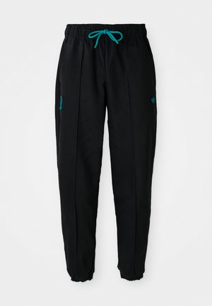 Zwarte sweatpants met een elastische tailleband en turquoise koord. Beschikt over zijzakken en een klein groen logo nabij de taille. Elastische boorden.