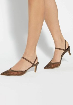 Brown slingback heels with a pointed toe. Features embellishments and a textured surface. Slightly raised heel with a thin ankle strap.