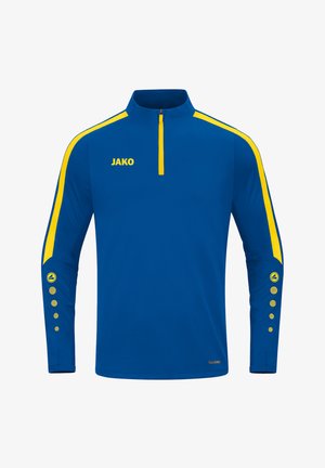 Blauwe sportieve half-zip shirt met gele zijkanten. Voorzien van een geel logo "JAKO" en knoopaccenten op de mouwen. Gegarandeerd textuurdesign.
