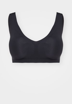 Black wireless bra with wide straps, a deep V-neckline, and seamless design. Made from smooth, stretchy fabric for comfortable fit.
