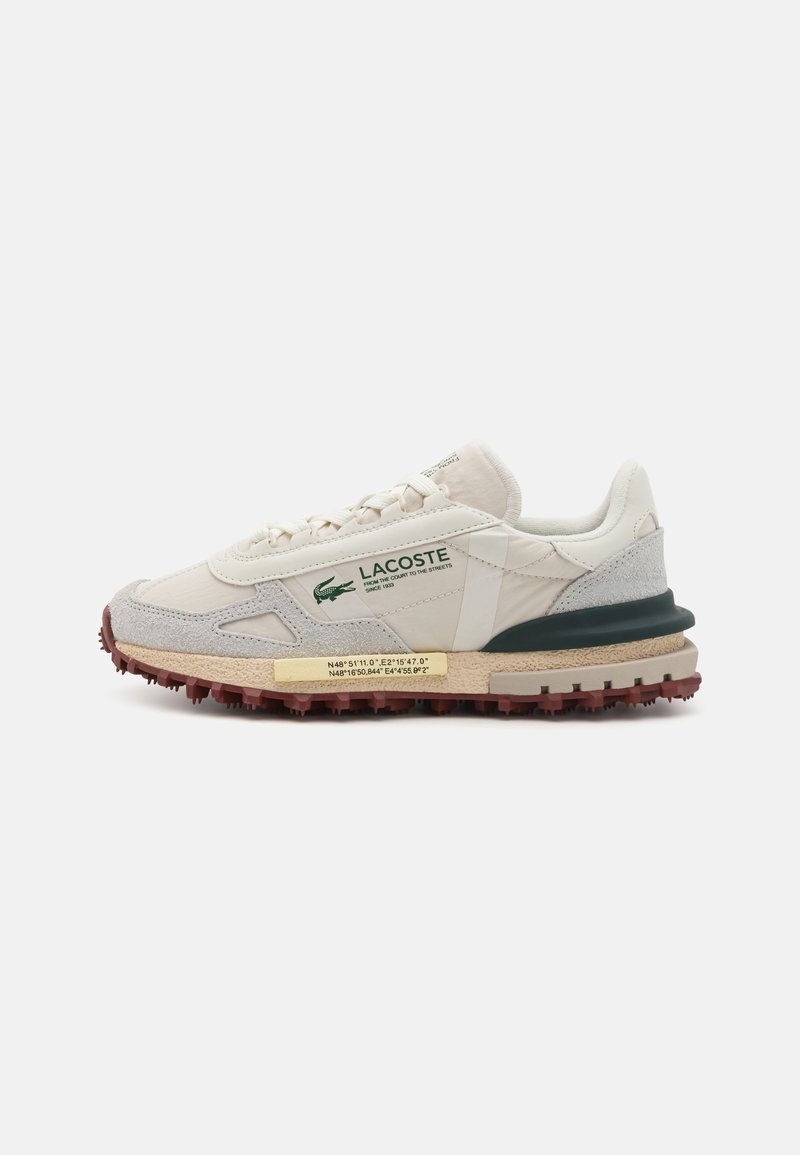 Lacoste sneakers featuring a cream synthetic upper with grey suede accents, green hardware, and a textured red outsole.
