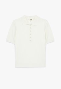 Kortærmet polo i off-white bomuld med spids krave og placket med seks knapper. Blød tekstur med en tætsiddende silhuet.