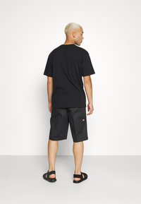 Edwin OVERSIZE BASIC UNISEX - Lihtne T-särk - black