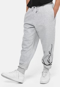 Karl Kani - SIGNATURE RETRO PANTS - Treningo apatinė dalis - grey/black Miniatiūros vaizdas 1