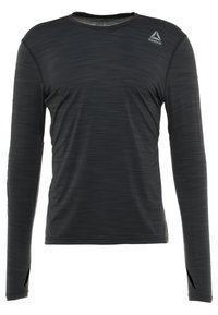 Czarna, długorękawowa koszulka sportowa z subtelnymi poziomymi paskami i logo Reebok na górnej lewej części klatki piersiowej.