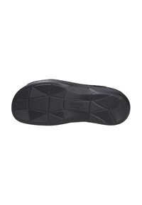 Black rubber shoe sole with textured surface, featuring geometric traction patterns and a contoured shape for added grip and stability.