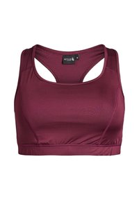 Sujetador deportivo color granate con una textura suave, diseño de espalda cruzada y una banda elástica en la parte inferior. Incluye una etiqueta con la palabra "ACTIVE" y la talla "M".