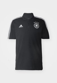 Černé polo tričko s límečkem, se bílým logem Adidas a třemi hvězdami nad kulatým emblémem Německé fotbalové asociace. Bílé pruhy na rukávech.
