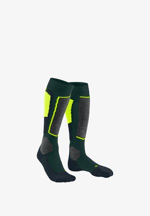 Dunkelgrüne knielange Socken mit grauen und hellgelben Musterakzenten. Verfügt über verstärkte Abschnitte und strukturierte Stoffe für Langlebigkeit.