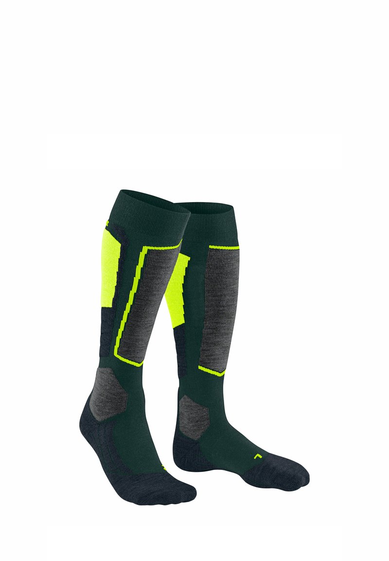 Calze lunghe fino al ginocchio di un verde scuro con accenti a motivi grigi e giallo brillante. Presentano sezioni rinforzate e un tessuto testurizzato per maggiore durata.