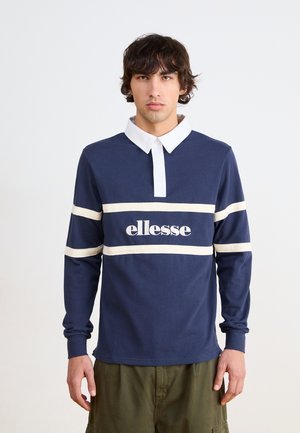 Langärmliges dunkelblaues Poloshirt mit weißem Kragen und horizontalen cremefarbenen Streifen. Auf der Vorderseite befindet sich das weiße "ellesse"-Logo.