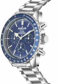Silver stainless steel watch with a blue face, chronograph features, rotating bezel, and three subdials. Water-resistant to 100 meters.