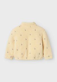 Fleece jacket in lichtgeel, met geborduurde roze flamingo's. Klassieke kraag en elastische manchetten met een zachte, gestructureerde afwerking.