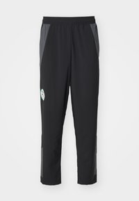 Pantalones deportivos negros con cintura elástica, paneles laterales grises, franjas reflectantes y un pequeño logo en la parte frontal. El material parece ligero.