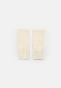 Mânuși fără degete de culoare crem, tricotate din lână cu manșete ribbate. Textură moale și formă rectangulară, concepute pentru căldură și mobilitate.