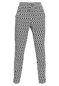 Pantalon à motif noir et blanc avec taille élastique et cordon de serrage ajustable. Comprend des poches latérales et une coupe fuselée.