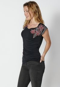 T-shirt in puro cotone bianca regular fit con stampa floreale E-TEES da Donna