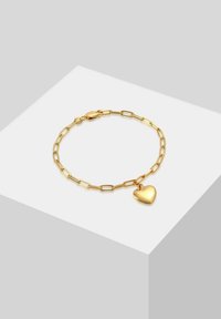 Goldene Kettenarmband mit verlängerten Gliedern und einem polierten Herzanhänger. Das Armband verfügt über einen sicheren Verschluss.