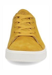 Yellow suede sneaker with thick laces and white rubber sole, shown from a front view with visible stitching details.