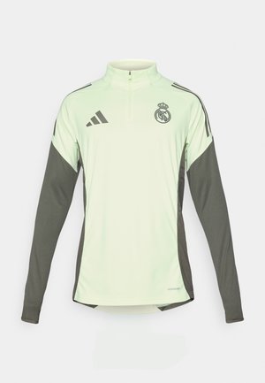 Lichtgroene lange mouwen shirt met donkere grijzige accenten, half-rits halslijn en Real Madrid-logo. Gemaakt van ademend materiaal.
