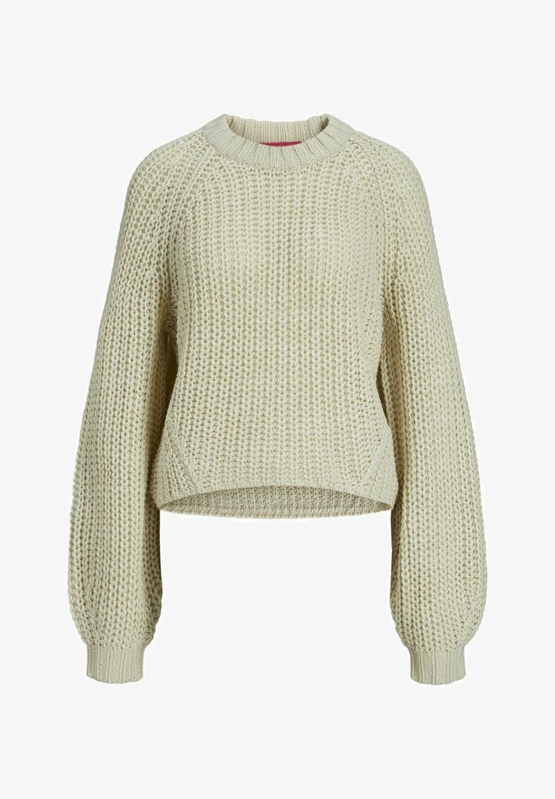 Grobovolnjen pulover v svetli bež barvi. Ima okroglo izrez in raglan rokave ter skrajšan rob. Teksturen material z ohlapnim krojem.