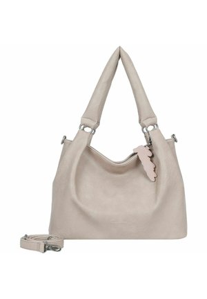 Sac à main en cuir beige clair avec deux poignées courtes, une bandoulière réglable et une étiquette décorative rose. Texture lisse, design minimaliste.
